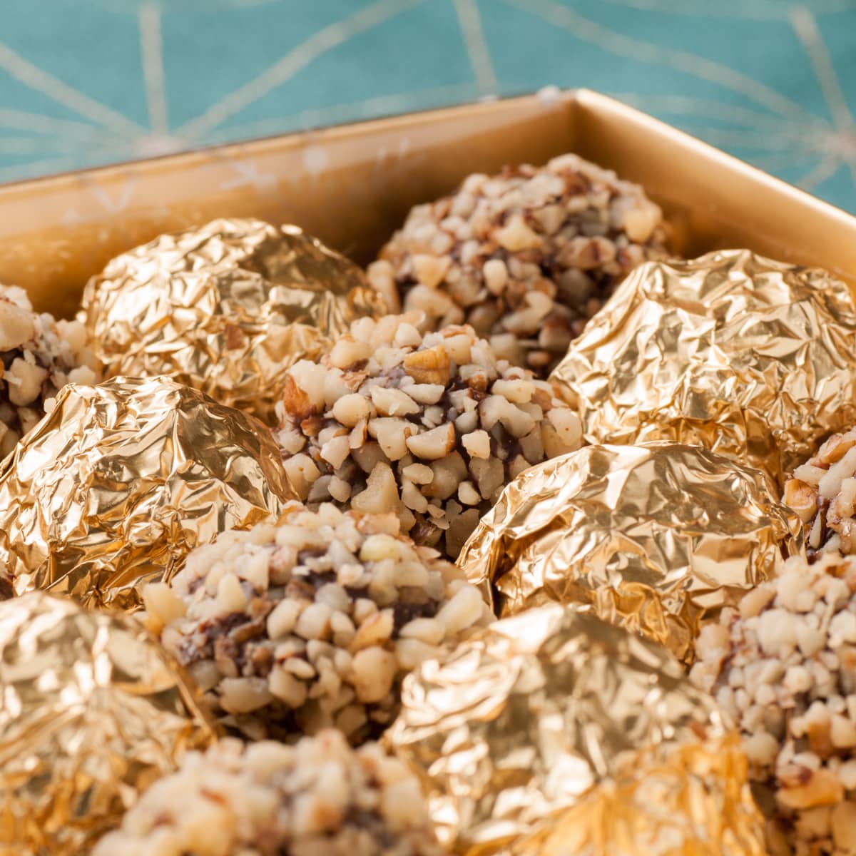 Close up of Melomakarona Truffles with Dark Chocolate (Honey-syrup Biscuits)