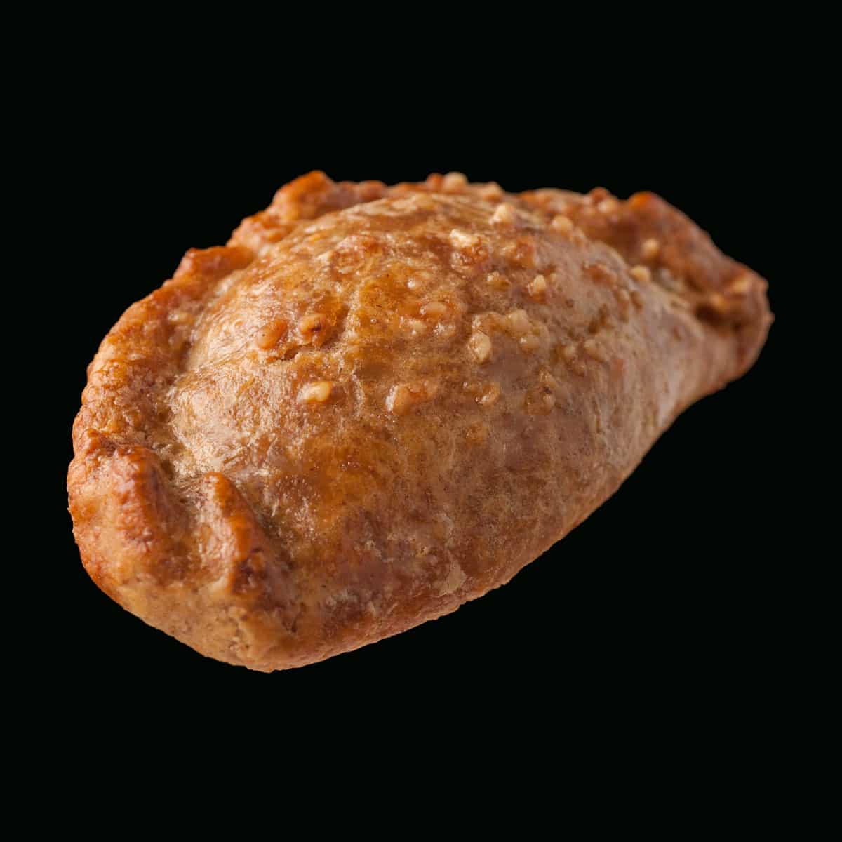 Tyropitaki - Kourou pie with tyropita (feta cheese) filling topped with hazelnut nibs